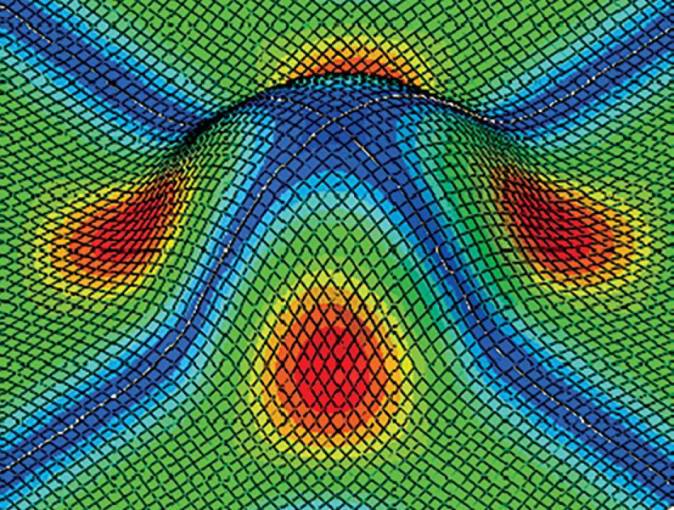 Simulation d’un essai d’emboutissage. L’échelle de couleur correspond à l’angle de cisaillement entre les fils de chaîne (sens long) et de trame (sens travers), du plus faible en bleu au plus élevé en rouge. 
